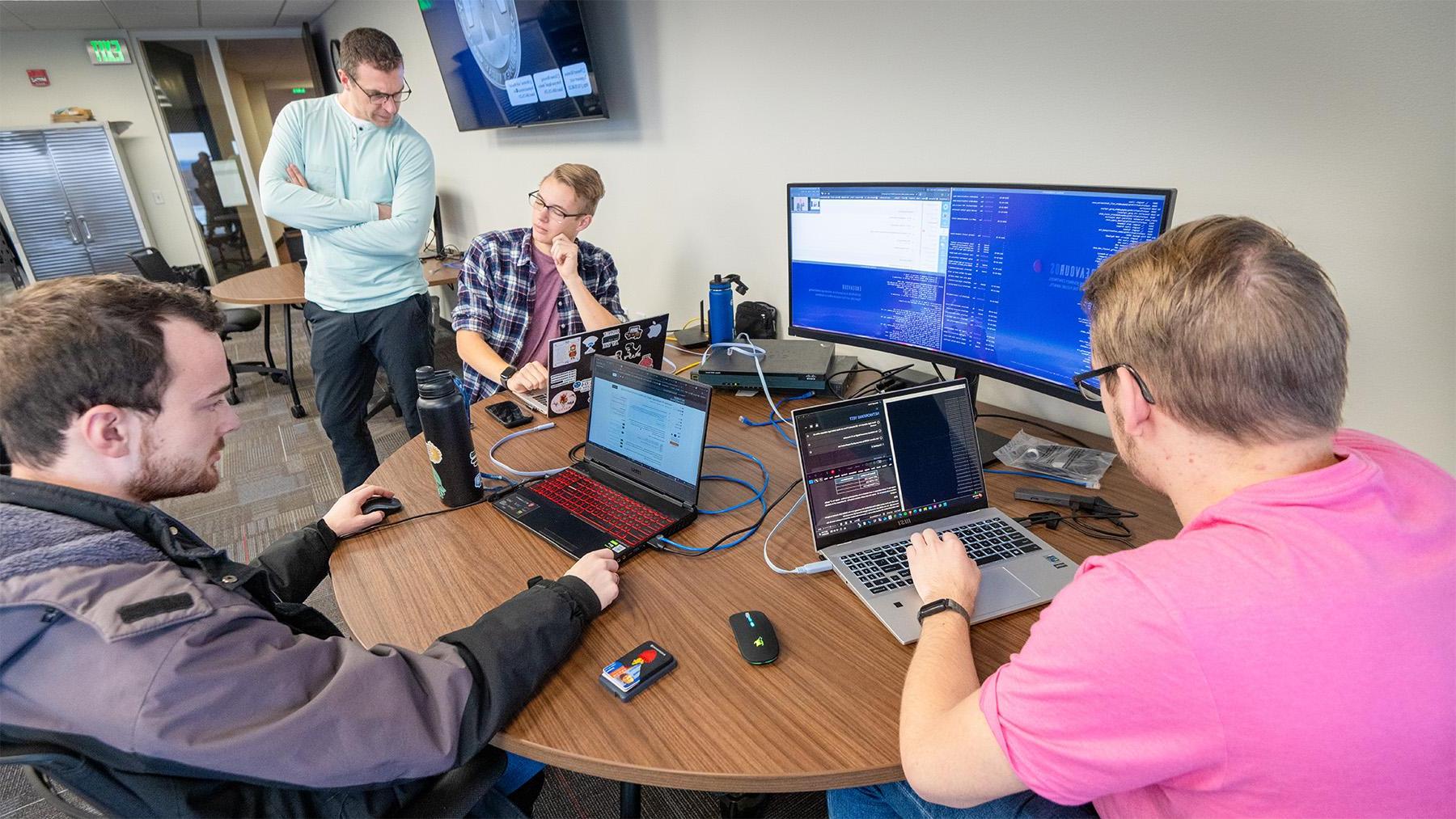 students working on a coding project in class